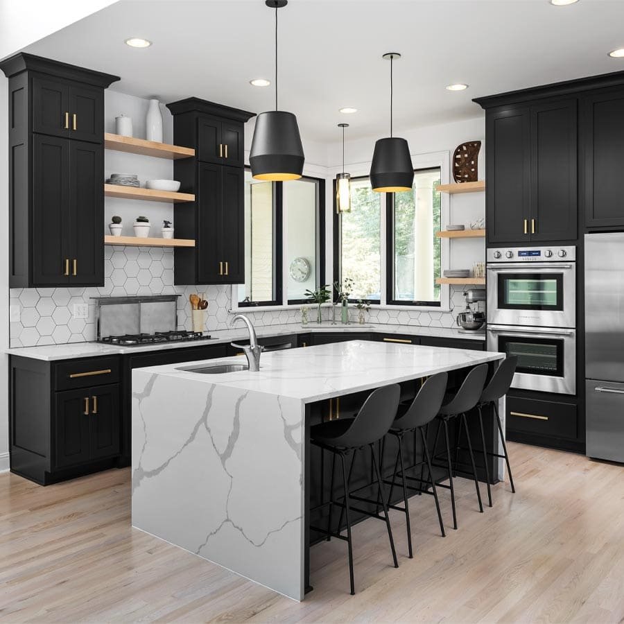 Black kitchen cabinets with gold hardware and marble island in Nashville, Tennessee